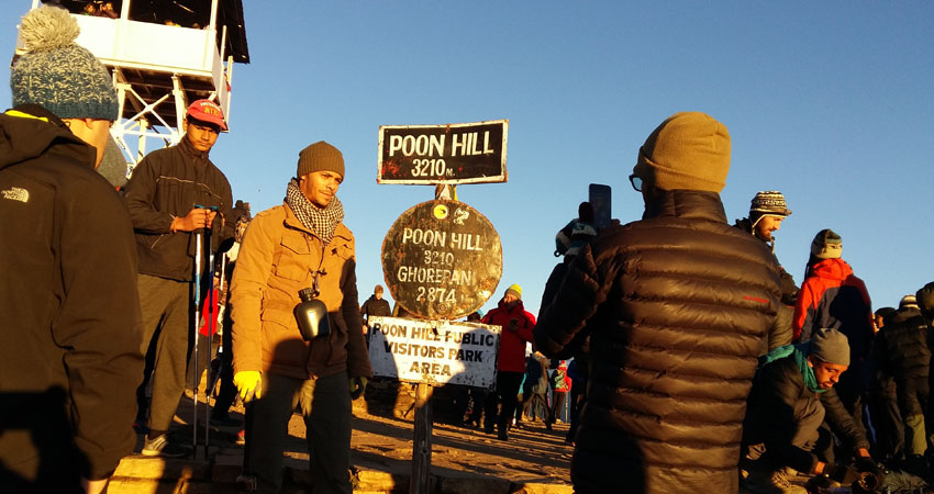 Poonhill with the sign board